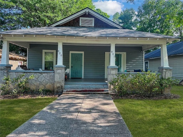 820 Elbert St SW, Atlanta, GA 30310 - bungalow featuring covered porch, a shingled roof, and a front lawn