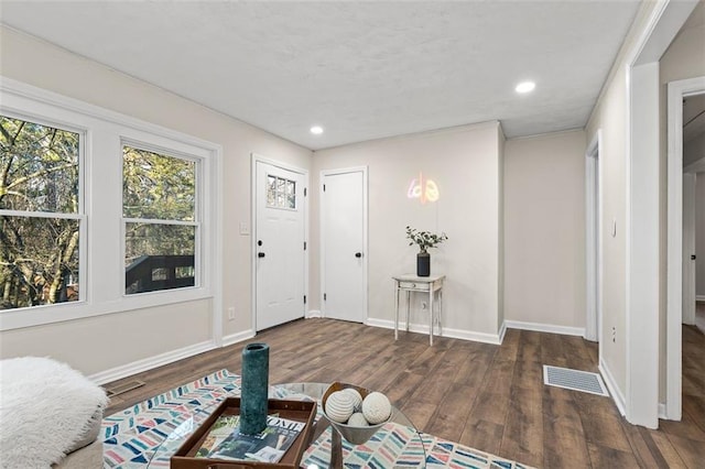 entryway with dark hardwood / wood-style floors