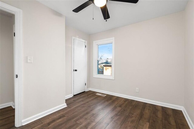 bedroom with dark hardwood / wood-style floors and ceiling fan