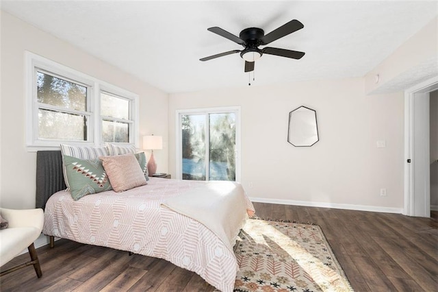 bedroom with dark wood-type flooring and ceiling fan