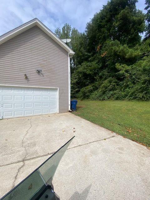 garage featuring a yard