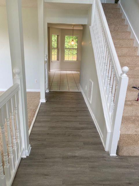 hall with dark hardwood / wood-style floors