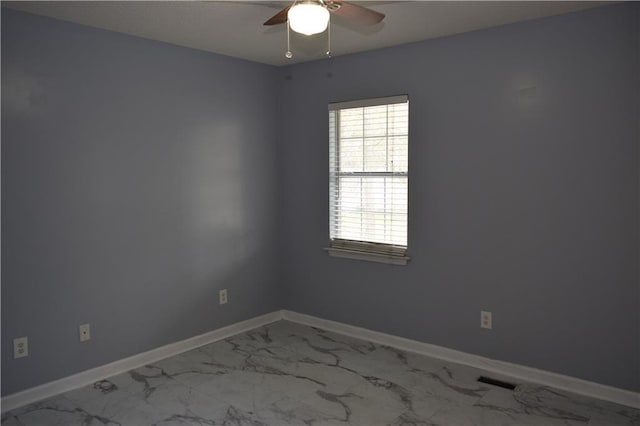 unfurnished room with ceiling fan