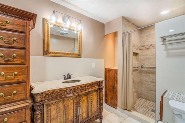 bathroom featuring vanity, tile patterned floors, toilet, walk in shower, and tile walls