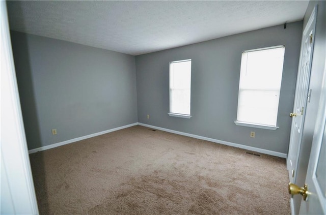 775 Heritage Valley Rd, Norcross, GA 30093 - empty room featuring carpet floors, a textured ceiling, and baseboards