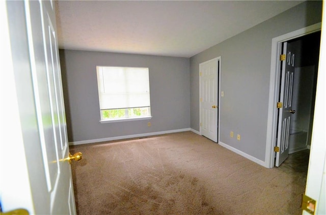 775 Heritage Valley Rd, Norcross, GA 30093 - unfurnished bedroom featuring carpet flooring and baseboards