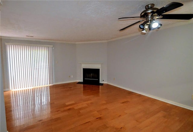 775 Heritage Valley Rd, Norcross, GA 30093 - unfurnished living room featuring wood finished floors, ceiling fan, baseboards, ornamental molding, and a fireplace with flush hearth