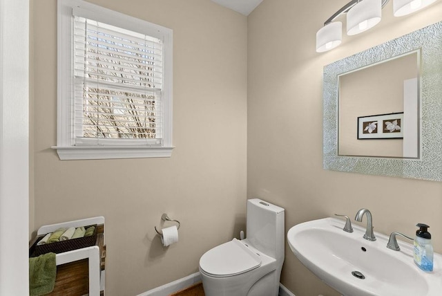 12350 Broadleaf Ln, Johns Creek, GA 30005 - half bath featuring a sink, healthy amount of natural light, and toilet