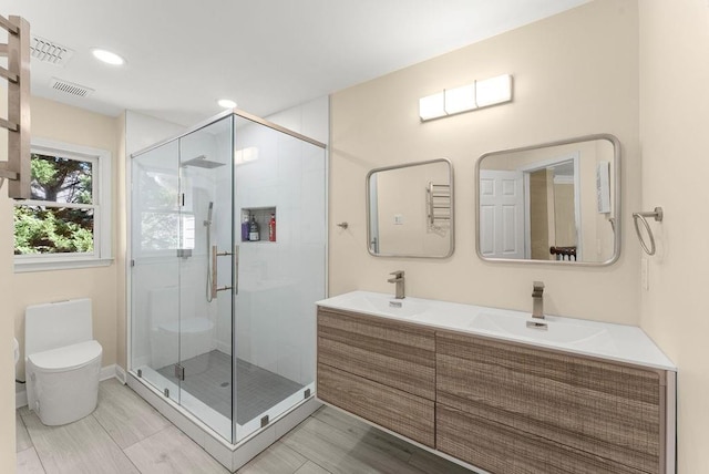 12350 Broadleaf Ln, Johns Creek, GA 30005 - full bathroom featuring toilet, a shower stall, double vanity, baseboards, and recessed lighting