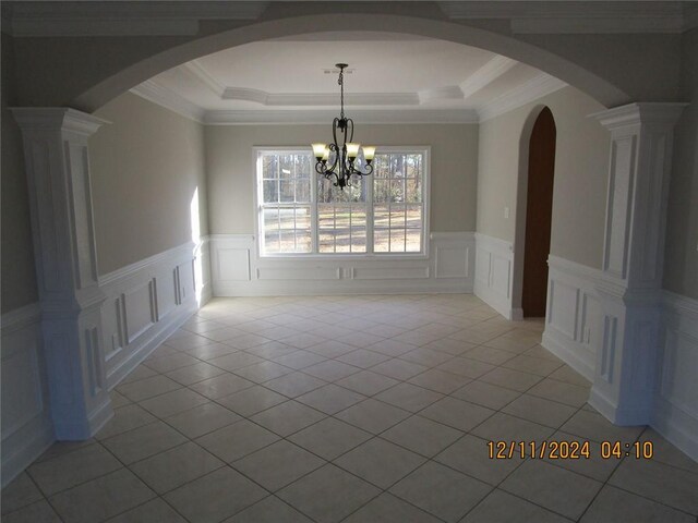 unfurnished living room with carpet flooring, a towering ceiling, a brick fireplace, ceiling fan, and beamed ceiling