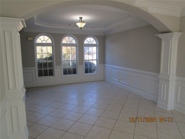 unfurnished living room featuring a wealth of natural light, ceiling fan, a fireplace, and carpet