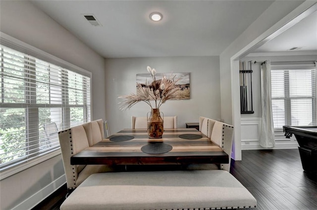 dining space featuring dark wood-type flooring