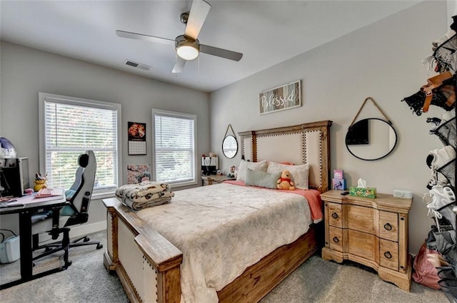 bedroom featuring light carpet and ceiling fan