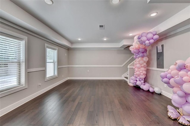 playroom featuring dark wood-type flooring