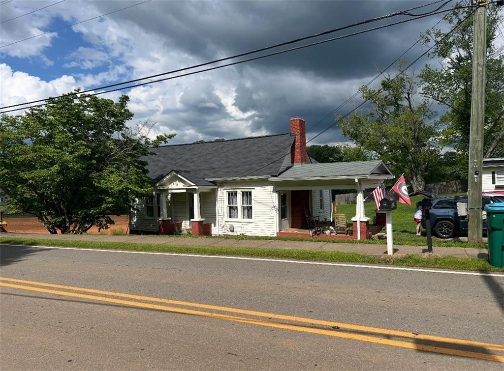508 Old Canton Rd, Ball Ground, GA 30107 - bungalow featuring covered porch and a chimney