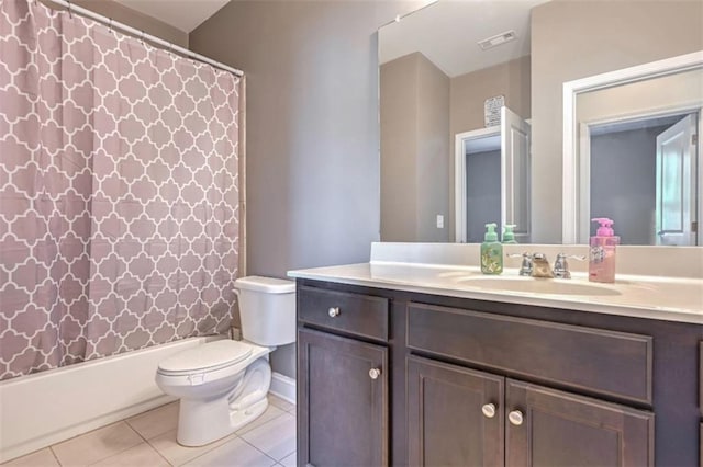 full bathroom featuring vanity, shower / bathtub combination with curtain, tile patterned floors, and toilet