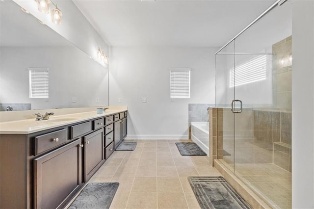 bathroom with vanity, shower with separate bathtub, and tile patterned floors