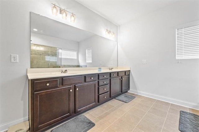 bathroom featuring vanity, an enclosed shower, and tile patterned floors