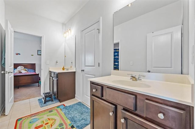 bathroom featuring tile patterned floors and vanity