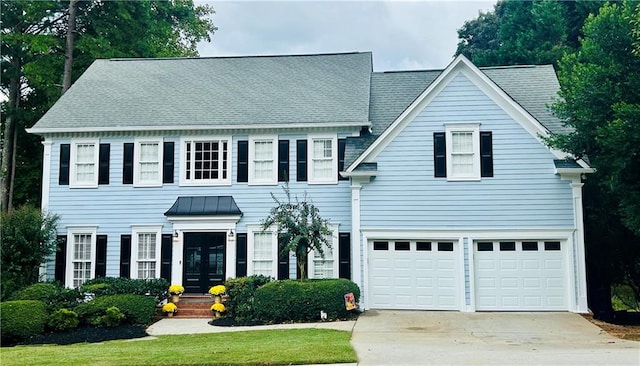 colonial-style house featuring a garage