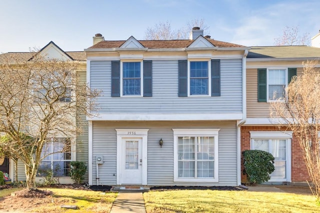 view of property featuring a front yard