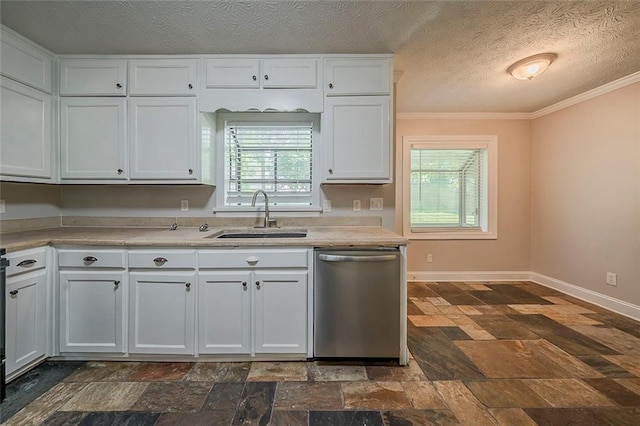 kitchen featuring crown molding, dishwasher, a sink, light countertops, and stone tile flooring