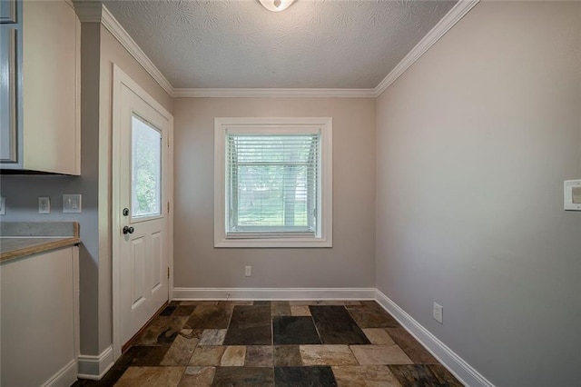 entryway featuring crown molding, a textured ceiling, baseboards, and stone finish flooring