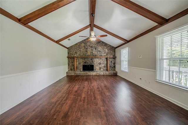 unfurnished living room with a ceiling fan, wood finished floors, and a healthy amount of sunlight