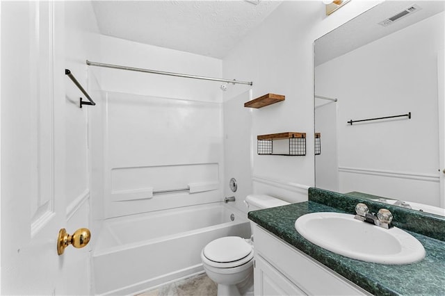 full bathroom featuring a textured ceiling, toilet, bathtub / shower combination, visible vents, and vanity