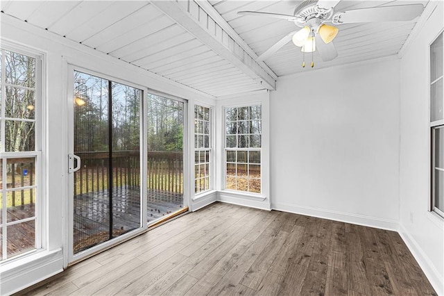 unfurnished sunroom featuring ceiling fan, wood finished floors, and a wooden deck