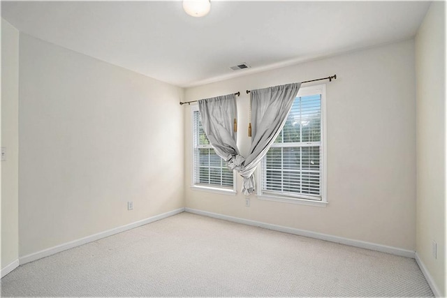 unfurnished room with carpet flooring