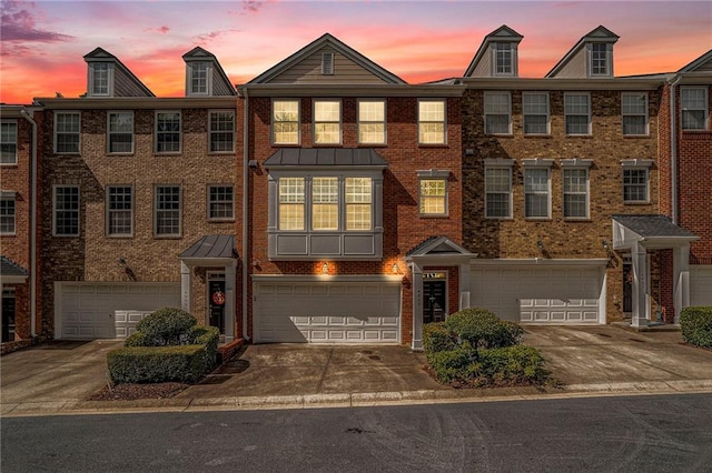 townhome / multi-family property featuring a garage