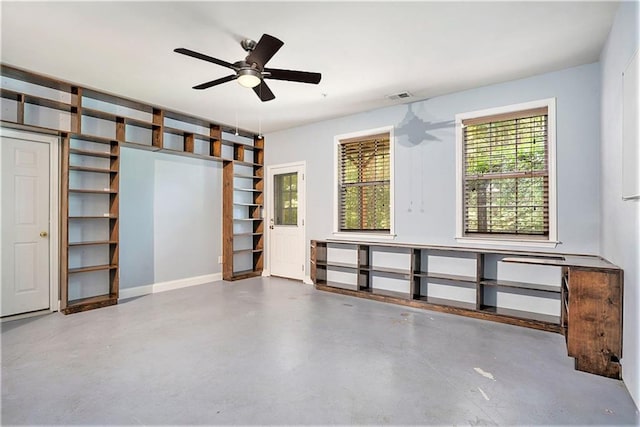 interior space with ceiling fan