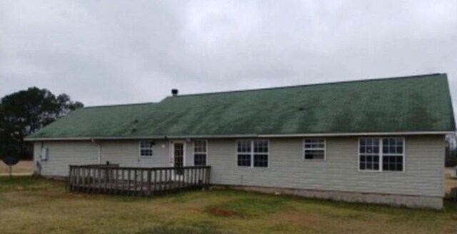 rear view of house featuring a deck