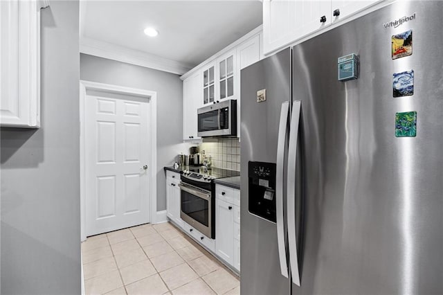 4100 Paces Walk SE Unit 2304, Atlanta, GA 30339 - kitchen with stainless steel appliances, dark countertops, crown molding, glass insert cabinets, and backsplash