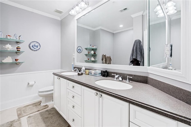 4100 Paces Walk SE Unit 2304, Atlanta, GA 30339 - full bath with toilet, double vanity, a wainscoted wall, crown molding, and tile patterned floors