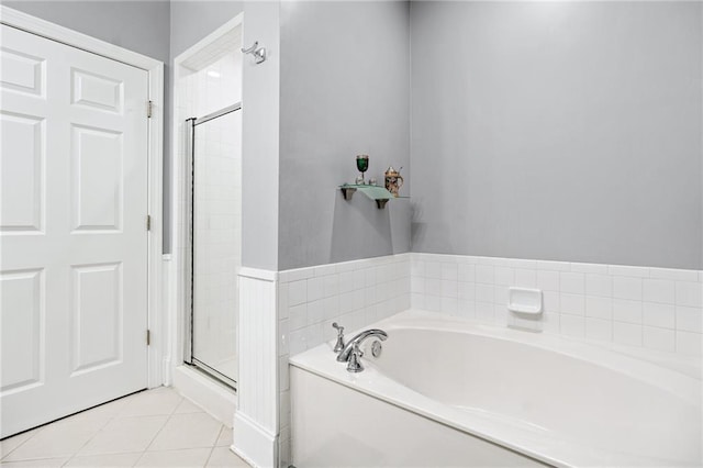 4100 Paces Walk SE Unit 2304, Atlanta, GA 30339 - full bathroom with a stall shower, a garden tub, and tile patterned flooring