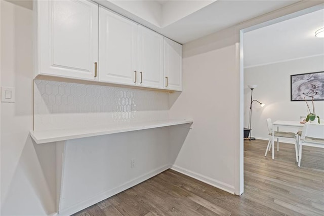 3236 Henderson Mill Rd Unit 1, Chamblee, GA 30341 - kitchen with light wood finished floors, white cabinets, and light countertops
