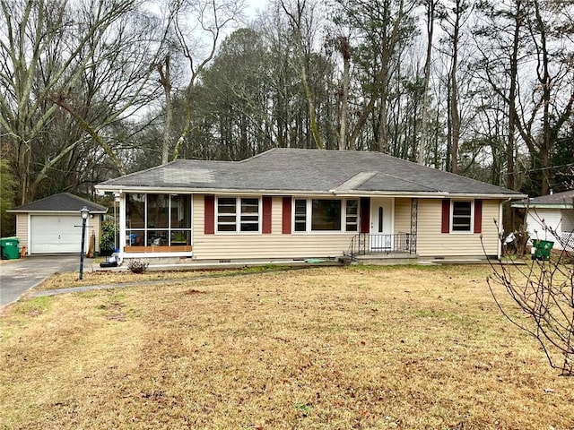 ranch-style house with an outbuilding, a garage, driveway, crawl space, and a front yard