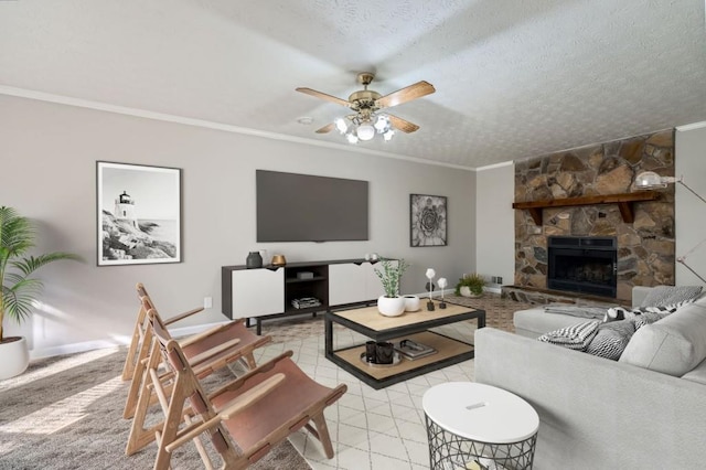 tiled living room with a stone fireplace, crown molding, ceiling fan, and a textured ceiling