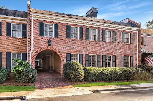 3456 Paces Pl NW, Atlanta, GA 30327 - georgian-style home featuring brick siding and a chimney