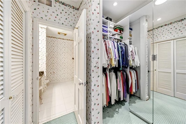 3456 Paces Pl NW, Atlanta, GA 30327 - bathroom with wallpapered walls, a walk in closet, recessed lighting, and a walk in shower