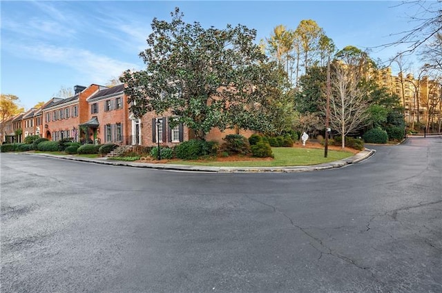 3456 Paces Pl NW, Atlanta, GA 30327 - view of asphalt road with curbs and a residential view