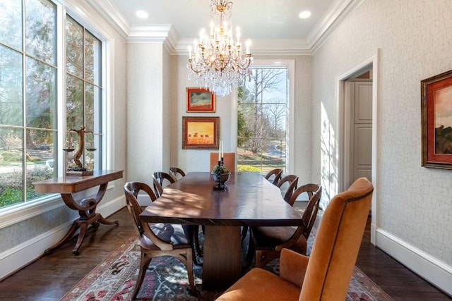 dining room featuring dark wood-style flooring, wallpapered walls, baseboards, and ornamental molding