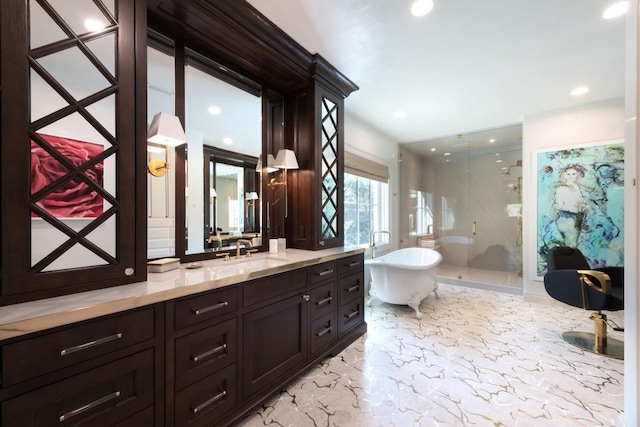 bathroom featuring vanity, a freestanding tub, recessed lighting, a shower stall, and marble finish floor