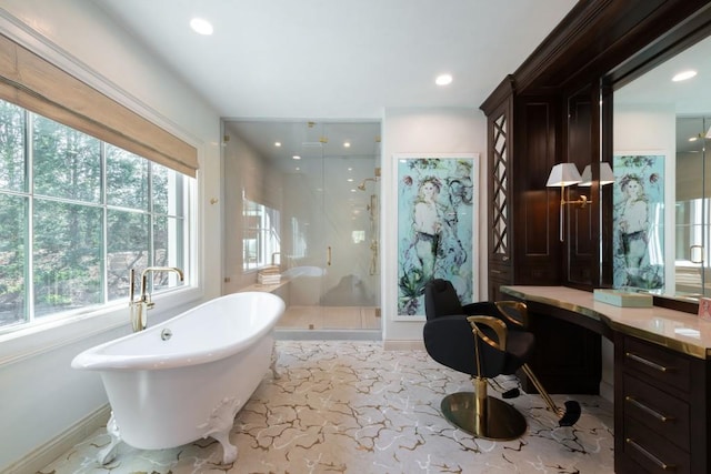 bathroom with vanity, baseboards, a freestanding tub, recessed lighting, and a stall shower