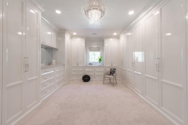 unfurnished room featuring recessed lighting, light colored carpet, a chandelier, and a decorative wall