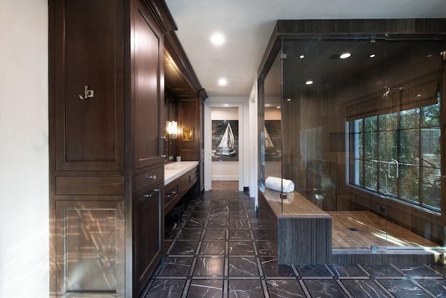 bathroom with recessed lighting and vanity