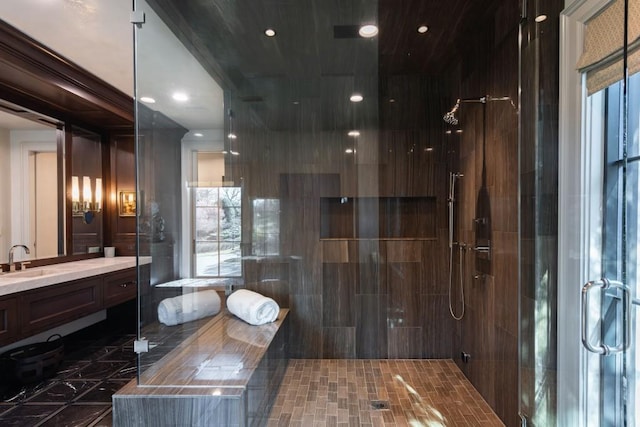 bathroom featuring recessed lighting, a stall shower, and vanity