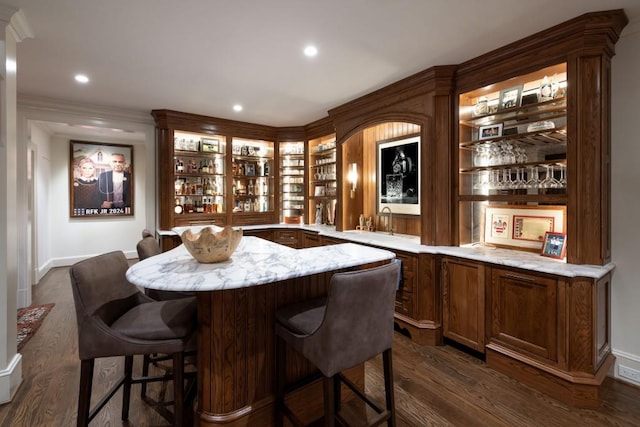 bar with wet bar, recessed lighting, dark wood-style floors, and a sink